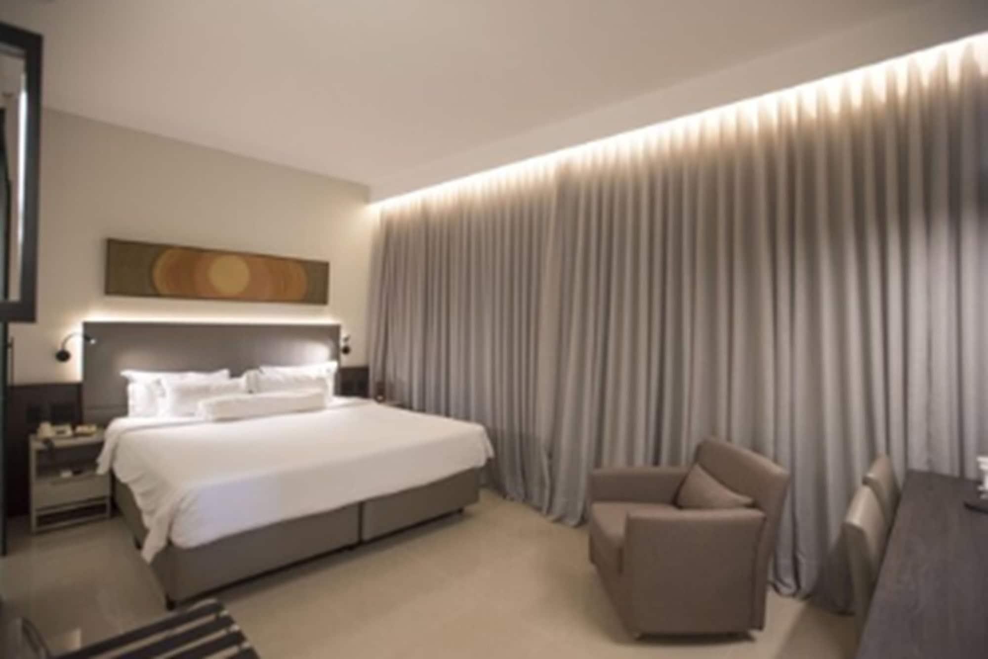 Royal Boutique Savassi Hotel Belo Horizonte Esterno foto A bedroom at the hotel